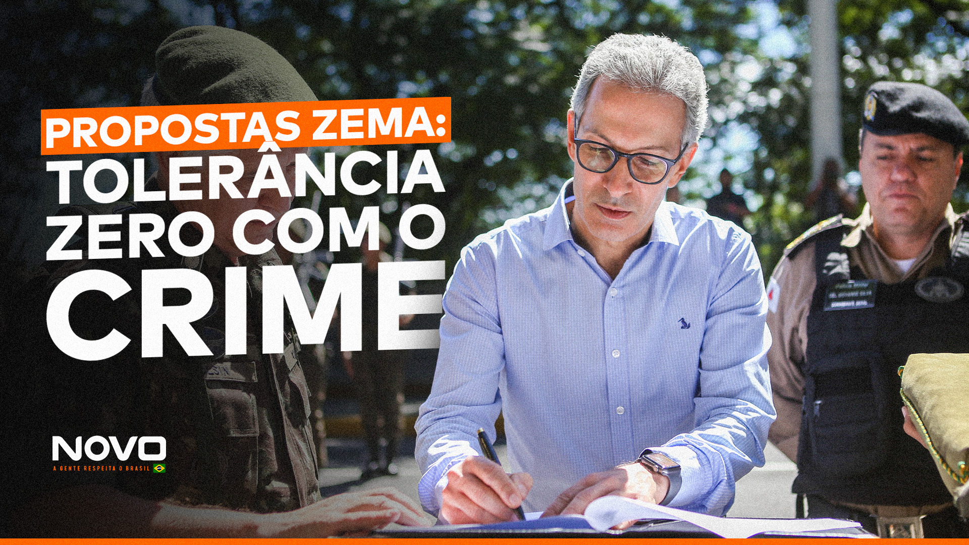 O pré-candidato à presidência, Romeu Zema, que tem uma série de propostas de combate ao crime, assina um documento cercado de policiais de Minas Gerais. Do seu lado esquerdo, lê-se “Propostas Zema: Tolerância zero com o crime”.